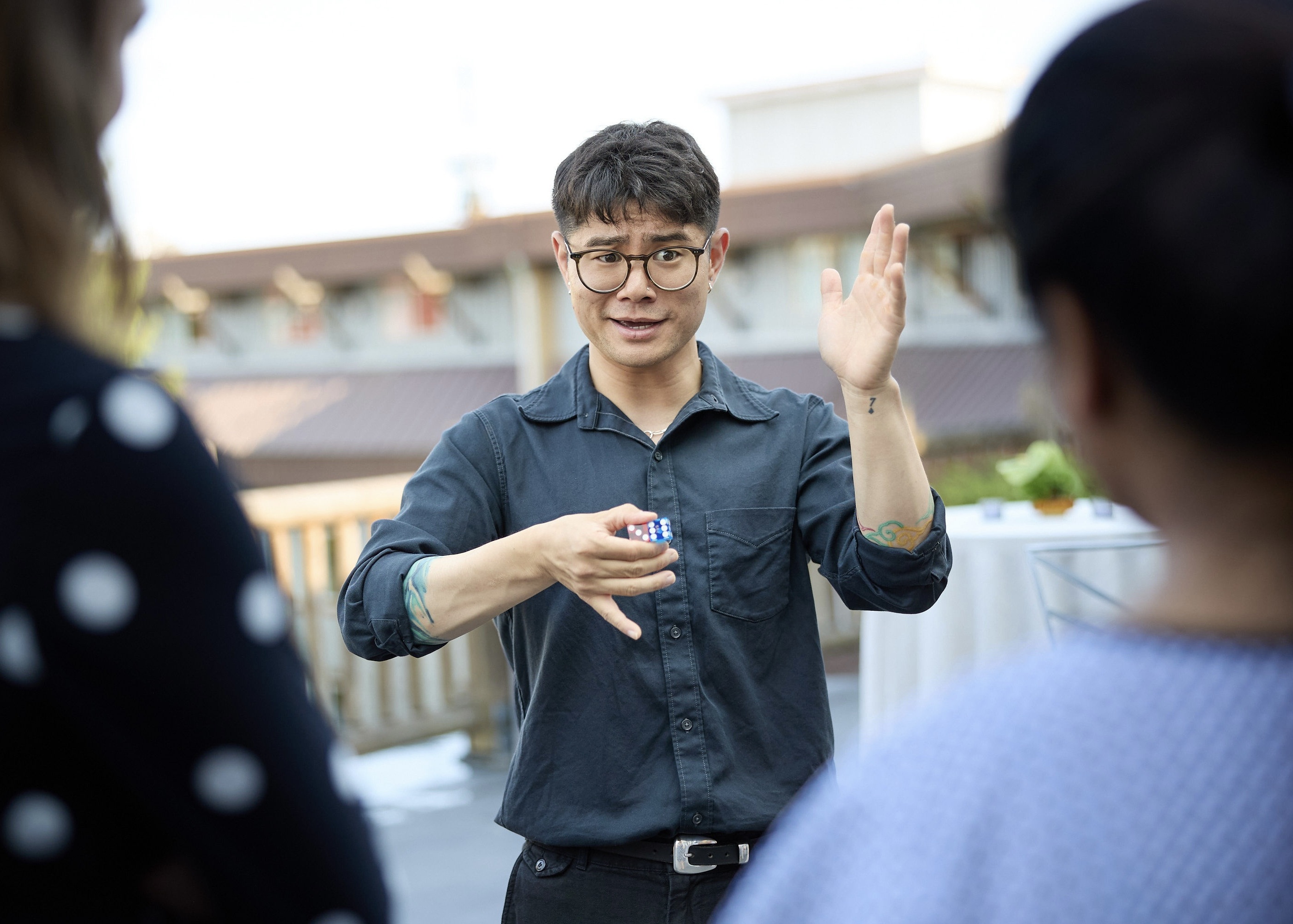 Travis Kim performing close-up magic at a Seattle corporate event